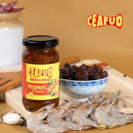 Spicy Thoothukudi-style prawn pickle featuring succulent prawns marinated in a rich blend of traditional spices, showcasing a vibrant red hue